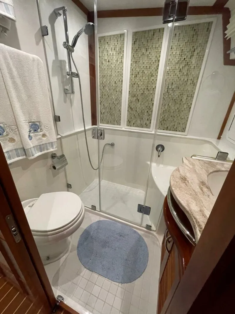 Slide: The Image of 2016 Sabre 48 Salon Express bathroom with shower, toilet, and sink. - 40