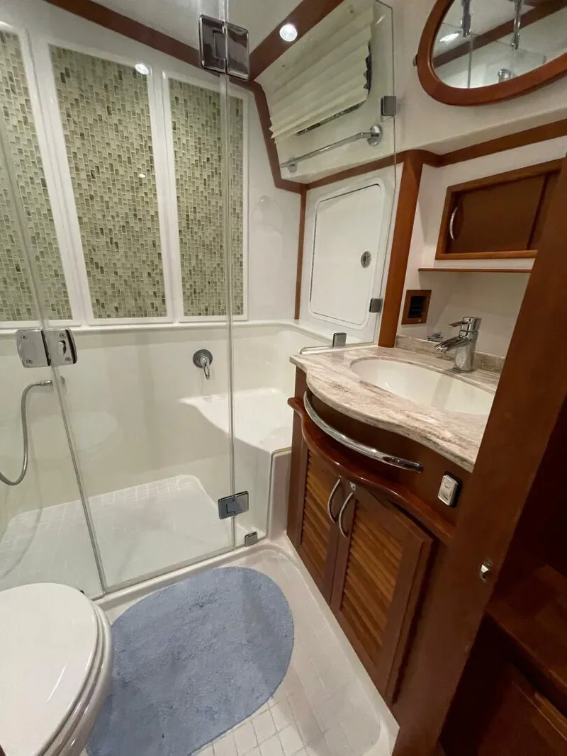 Slide: The Image of Luxurious bathroom in 2016 Sabre 48 Salon Express yacht with modern fixtures and elegant design. - 41