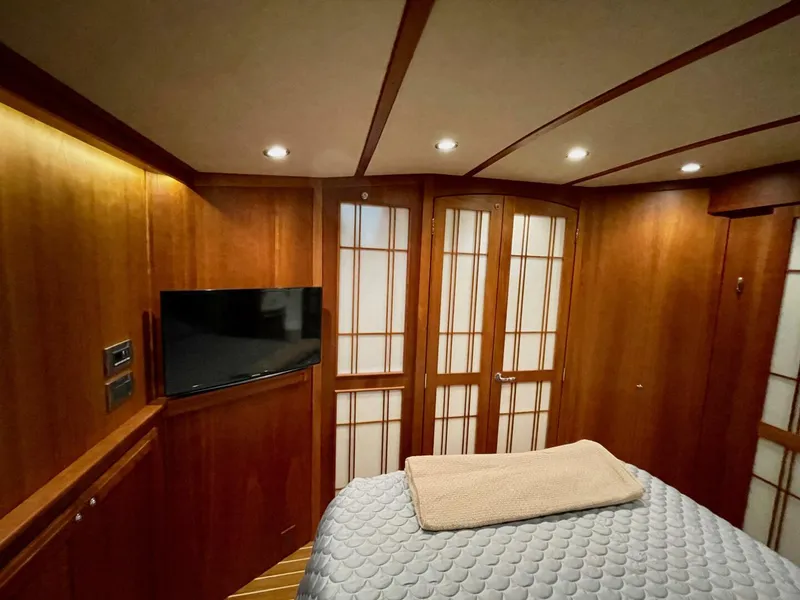 Slide: The Image of Luxurious interior of 2016 Sabre 48 Salon Express yacht with wood paneling and TV. - 44