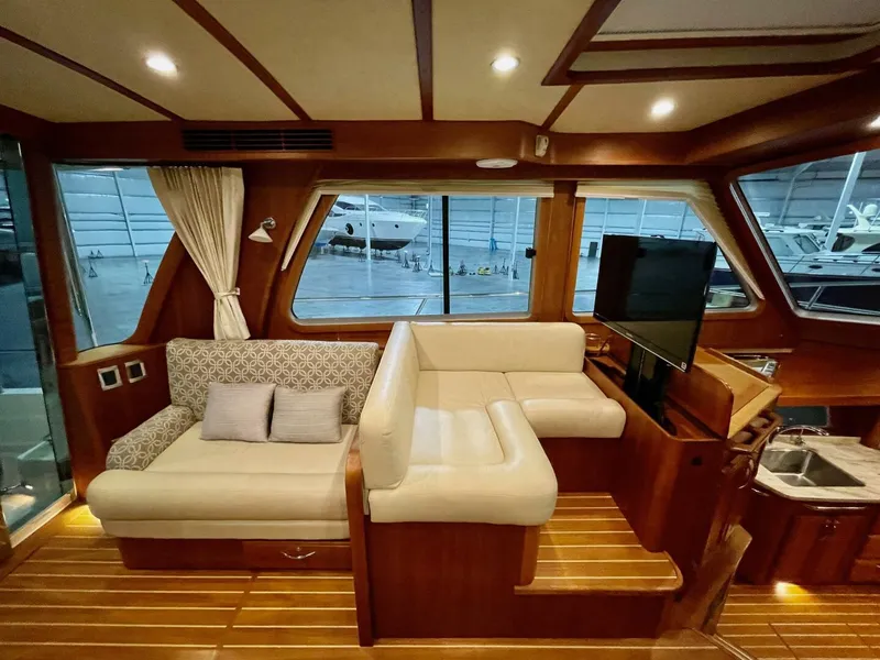 Slide: The Image of Interior of 2016 Sabre 48 Salon Express yacht with elegant seating and wood finishes. - 48