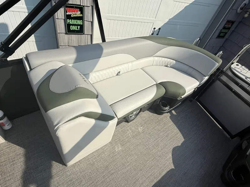 Slide: The Image of 2025 Avalon 2385 LSZ Quad Lounger boat interior with plush seating and modern design. - 18
