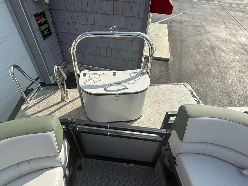 Slide: The Image of 2025 Avalon 2385 LSZ Quad Lounger Tri Toon boat interior with seating and railing. - 19