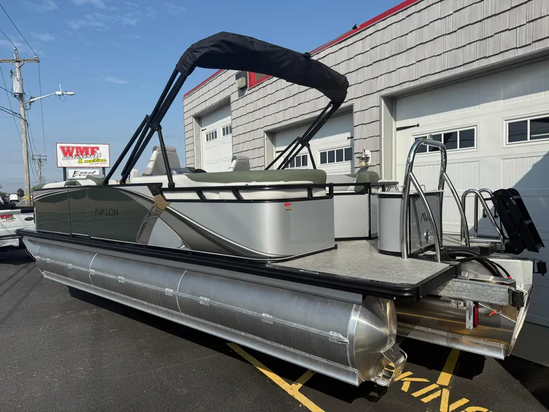 Slide: The Image of 2025 Avalon 2385 LSZ Quad Lounger Tri Toon boat, high performance, parked outside dealership. - 5