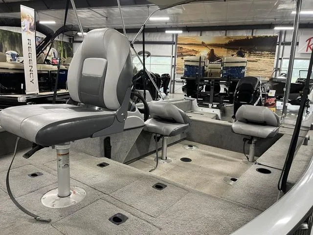 Slide: The Image of 2010 Tracker Pro-Guide V-16 SC boat interior with gray seating and spacious layout. - 17