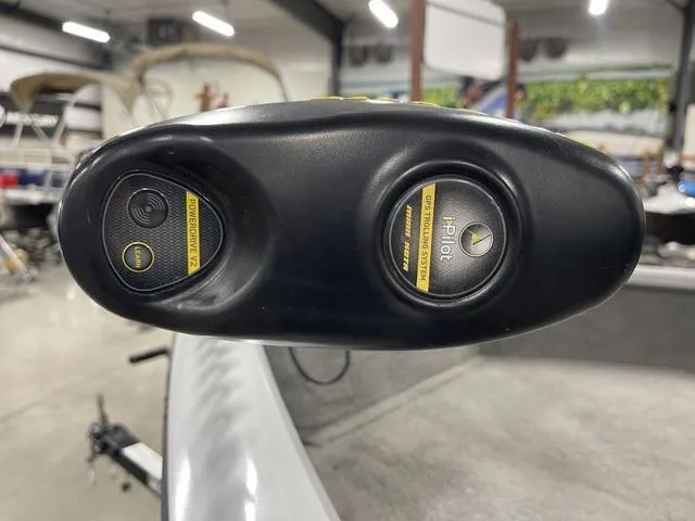 Slide: The Image of Close-up of a 2010 Tracker Pro-Guide V-16 SC boat control panel in a garage. - 18