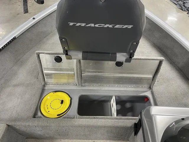 Slide: The Image of 2010 Tracker Pro-Guide V-16 SC boat interior with storage compartments and seating. - 20