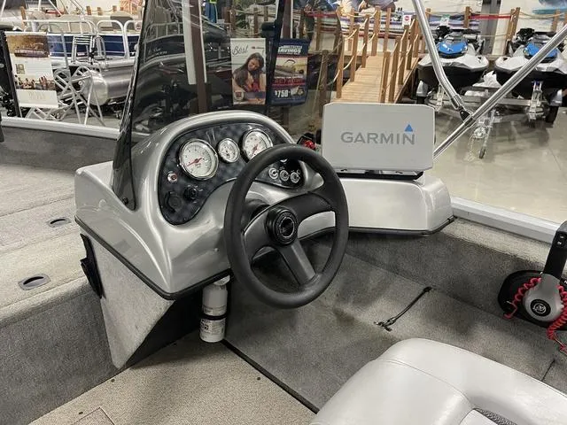 Slide: The Image of 2010 Tracker Pro-Guide V-16 SC boat dashboard with Garmin navigation system. - 27