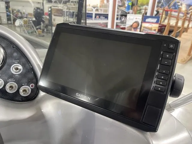 Slide: The Image of Garmin GPS device on 2010 Tracker Pro-Guide V-16 SC boat dashboard. - 29