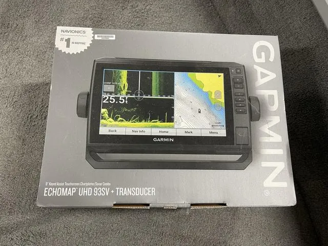 Slide: The Image of Garmin ECHOMAP UHD 93SV fishfinder box on gray carpet, 2010 Tracker Pro-Guide V-16 SC. - 30