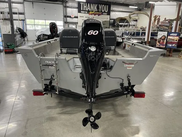 Slide: The Image of 2010 Tracker Pro-Guide V-16 SC boat with 60 HP motor in showroom. - 5