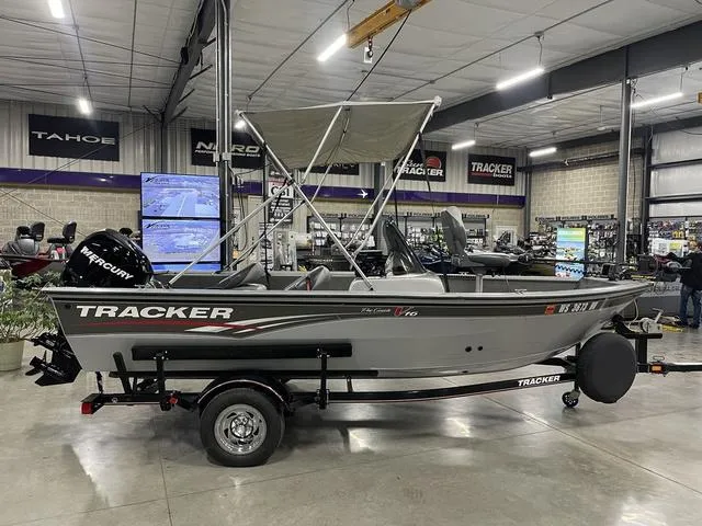 Slide: The Image of 2010 Tracker Pro-Guide V-16 SC boat on trailer in showroom. - 9