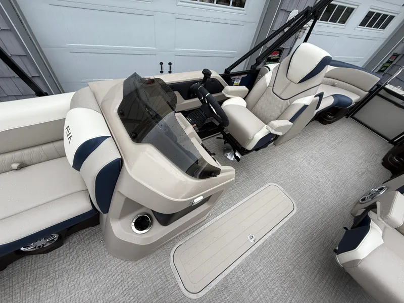 Slide: The Image of 2025 Avalon 2385 LSZ Quad Lounger Tri Toon boat, parked outdoors under a blue sky. - 17