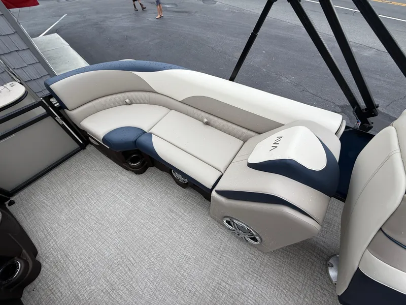 Slide: The Image of 2025 Avalon 2385 LSZ Quad Lounger Tri Toon boat with canopy, parked outdoors. - 19