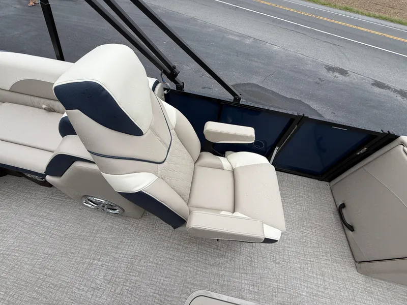 Slide: The Image of 2025 Avalon 2385 LSZ Quad Lounger Tri Toon boat with canopy, parked outdoors. - 20