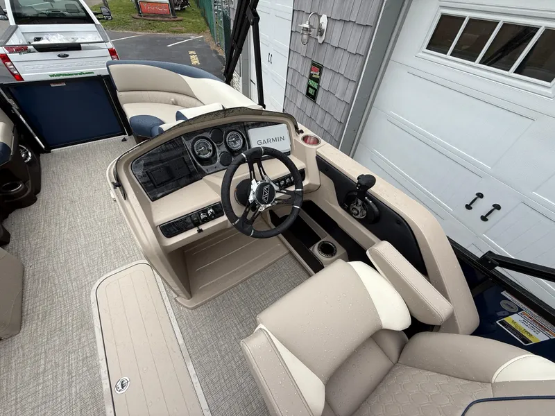 Slide: The Image of 2025 Avalon 2385 LSZ Quad Lounger Tri Toon boat, rear view with canopy and storage. - 21