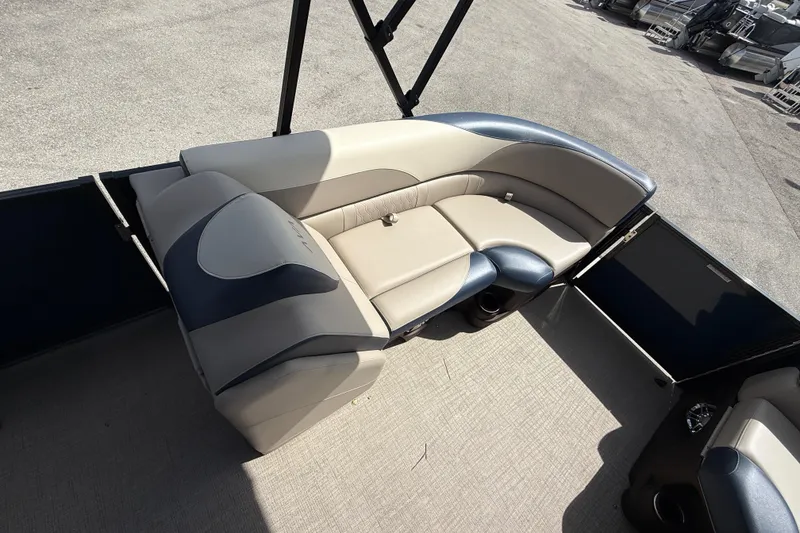 Slide: The Image of 2025 Avalon 2385 LSZ Quad Lounger interior with beige and blue seating. - 29