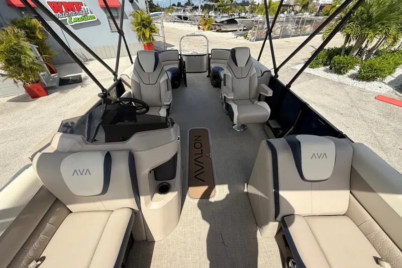 Slide: The Image of 2025 Avalon 2385 LSZ Quad Lounger Tri Toon boat interior with luxurious seating and helm. - 30
