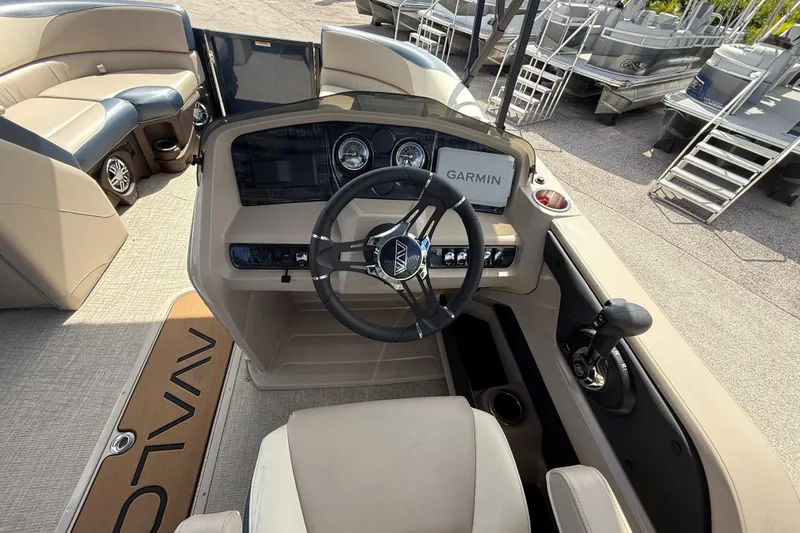 Slide: The Image of 2025 Avalon 2385 LSZ Quad Lounger boat dashboard with Garmin navigation system. - 37