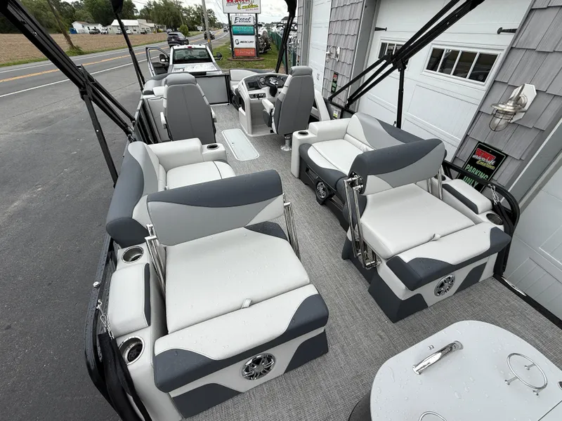 Slide: The Image of 2025 Avalon LSZ Quad Lounger 24' Tri Toon boat with spacious seating and modern design. - 12