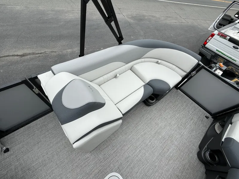 Slide: The Image of 2025 Avalon LSZ Quad Lounger boat interior with gray and white seating. - 15