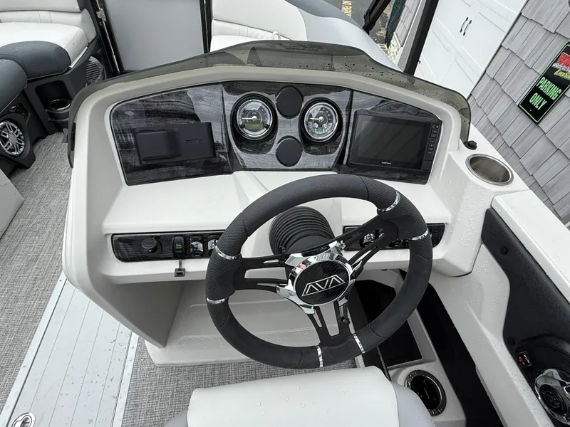 Slide: The Image of 2025 Avalon LSZ Quad Lounger dashboard with steering wheel and modern controls. - 20