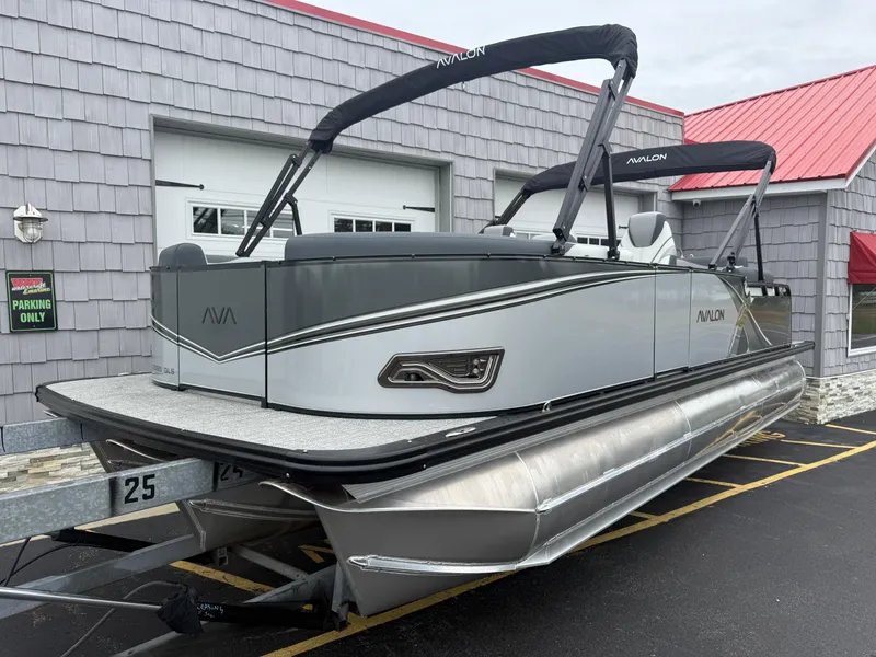 Slide: The Image of 2025 Avalon LSZ Quad Lounger 24' Tri Toon High Performance boat on trailer. - 3