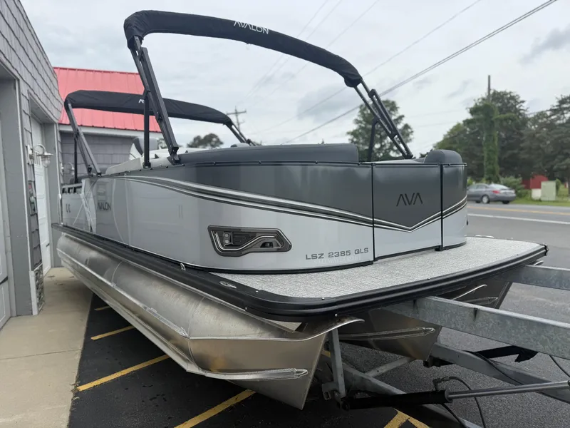 Slide: The Image of 2025 Avalon LSZ Quad Lounger 24' Tri Toon High Performance boat on trailer. - 8