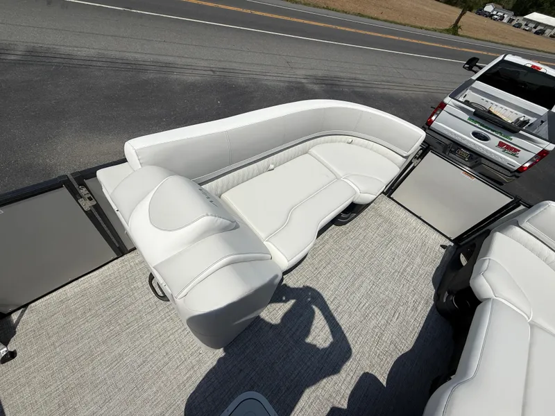 Slide: The Image of 2025 Avalon 2385 Catalina Quad Lounger interior with white seating, viewed from above. - 16