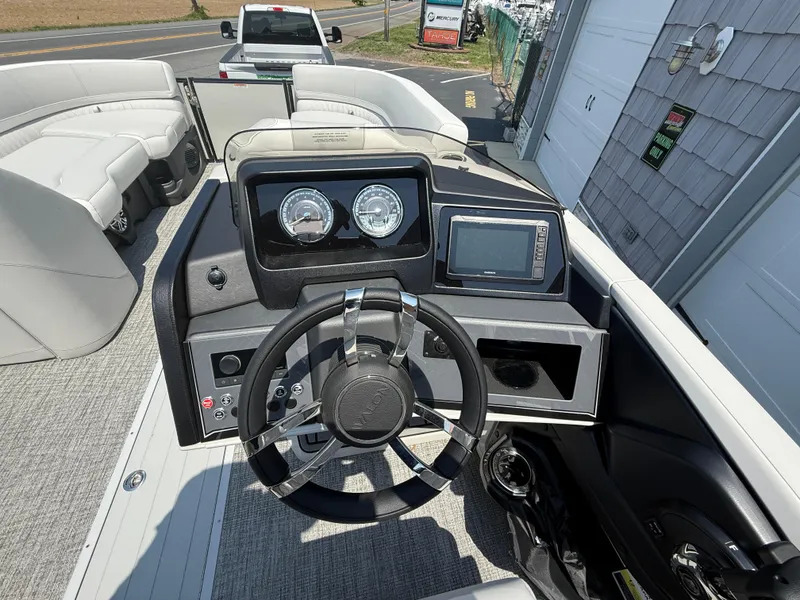 Slide: The Image of 2025 Avalon 2385 Catalina Quad Lounger dashboard with steering wheel and gauges. - 22