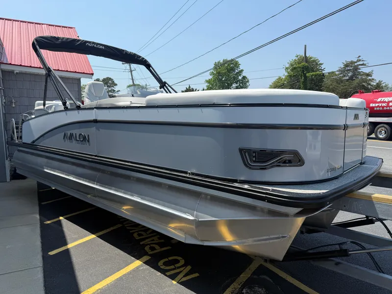 Slide: The Image of 2025 Avalon 2385 Catalina Quad Lounger, Tri Toon High Performance boat, docked outdoors. - 9