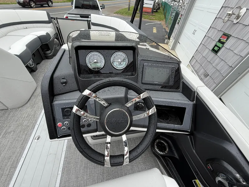Slide: The Image of 2025 Avalon 2385 Catalina Quad Lounger dashboard with steering wheel and gauges. - 19