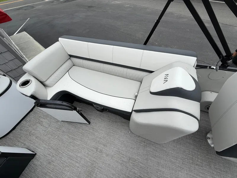 Slide: The Image of 2025 Avalon 2385 Catalina Quad Lounger interior with sleek, modern seating and cup holder. - 22