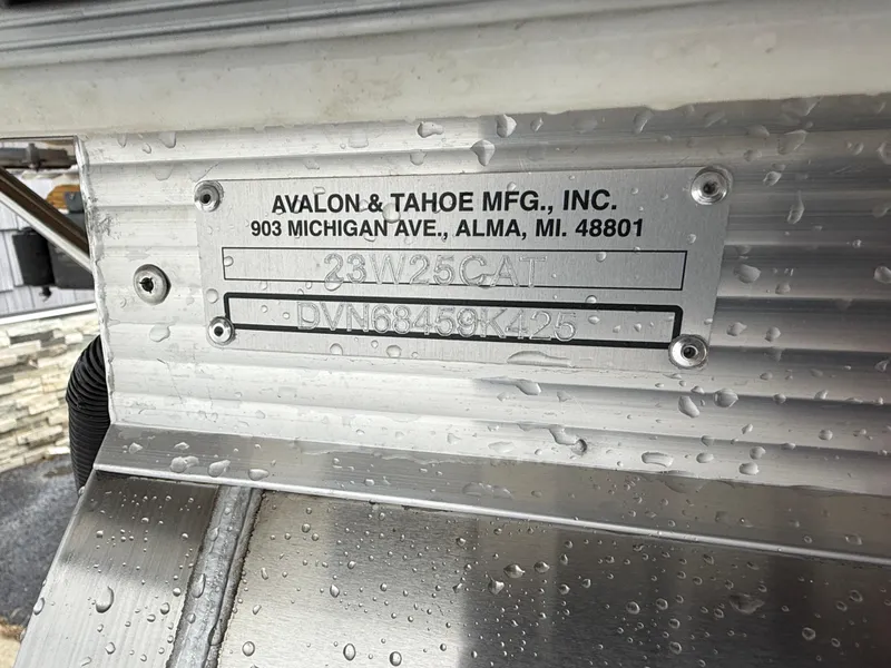 Slide: The Image of Metal plate on Avalon 2385 Catalina boat, showing manufacturer details and serial number. - 24