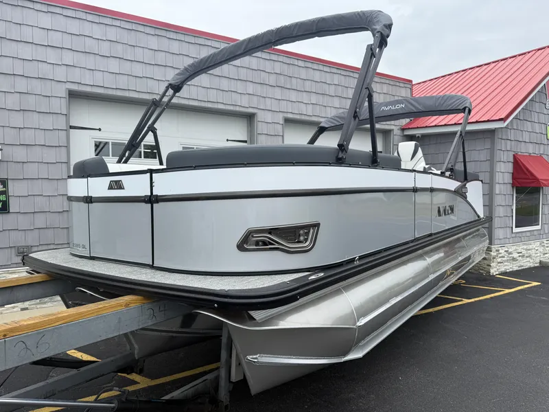 Slide: The Image of 2025 Avalon 2385 Catalina Quad Lounger Tri Toon, high-performance pontoon boat in a showroom. - 3