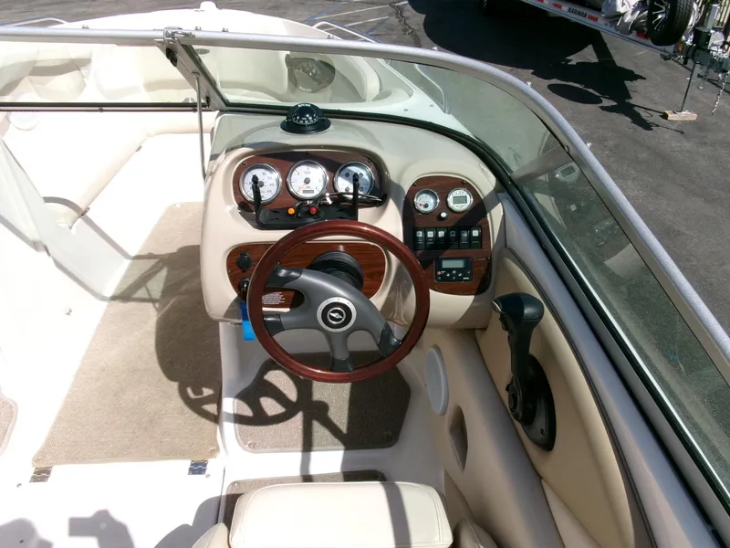 Slide: The Image of 2007 Chaparral 210 SSi boat interior with steering wheel and dashboard controls. - 10