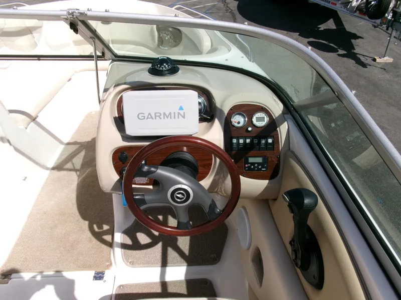 Slide: The Image of 2007 Chaparral 210 SSi boat dashboard with Garmin GPS and wood accents. - 11