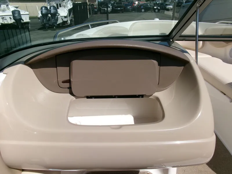 Slide: The Image of 2007 Chaparral 210 SSi boat interior dashboard with storage compartment. - 16