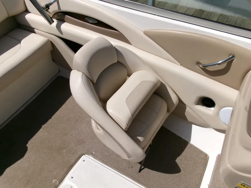 Slide: The Image of Interior of a 2007 Chaparral 210 SSi boat with beige seating and carpet. - 18