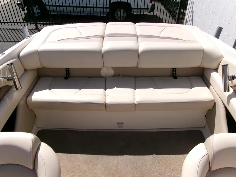Slide: The Image of 2007 Chaparral 210 SSi boat interior with beige seating and carpet. - 19