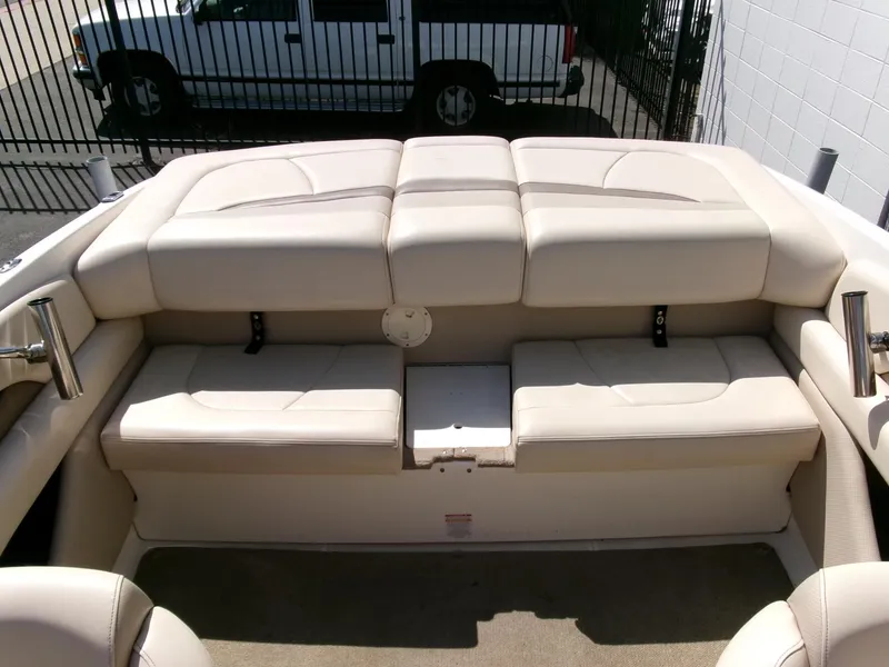 Slide: The Image of 2007 Chaparral 210 SSi boat interior with beige cushioned seating. - 20