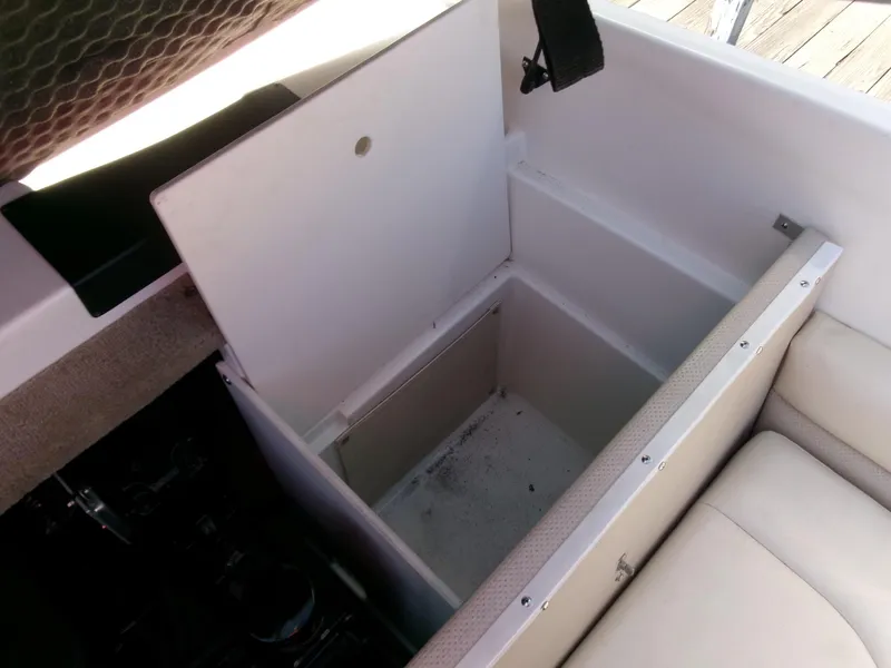 Slide: The Image of Open storage compartment in 2007 Chaparral 210 SSi boat interior. - 25