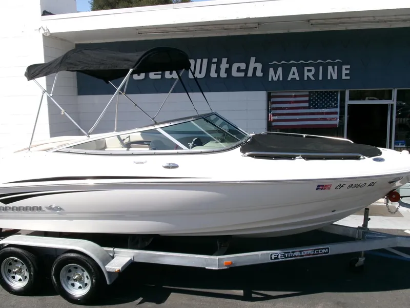 Slide: The Image of 2007 Chaparral 210 SSi boat on trailer at dealership, with black canopy. - 28
