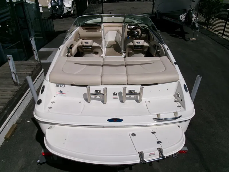 Slide: The Image of 2007 Chaparral 210 SSi boat, rear view, beige interior, parked on pavement. - 31