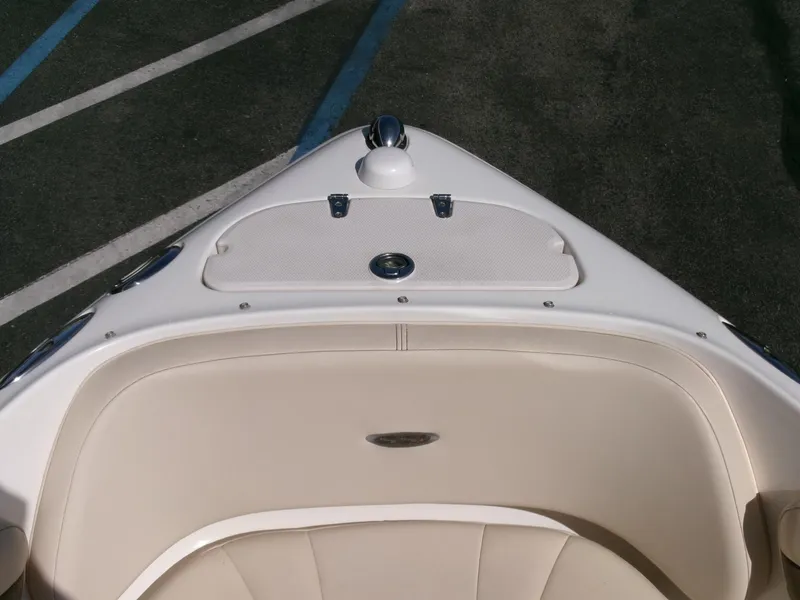 Slide: The Image of 2007 Chaparral 210 SSi boat bow with beige seating and storage compartment. - 4