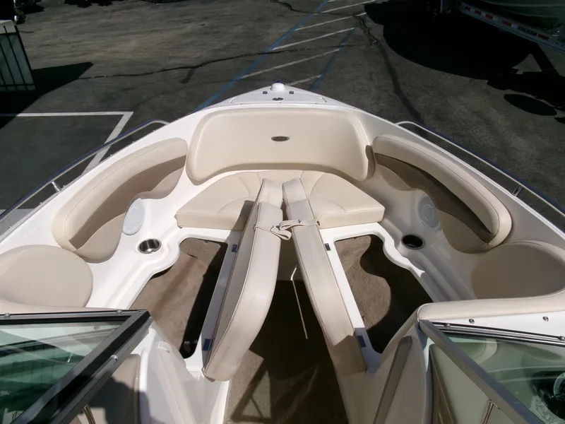 Slide: The Image of 2007 Chaparral 210 SSi boat interior with beige seating and spacious layout. - 7