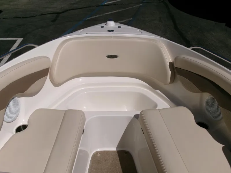 Slide: The Image of 2007 Chaparral 210 SSi boat interior with beige seating and white accents. - 8