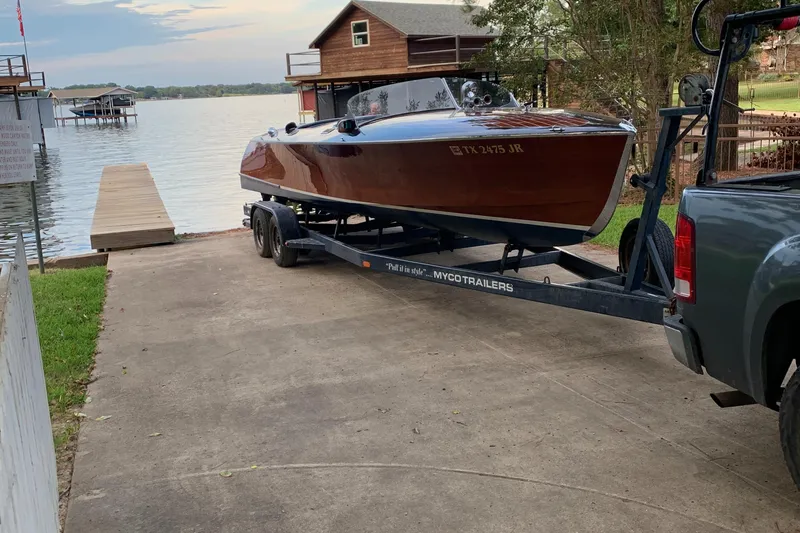 Slide: The Image of 2001 Hugh Saint Shearliner 27 boat on trailer by lakeside dock. - 6