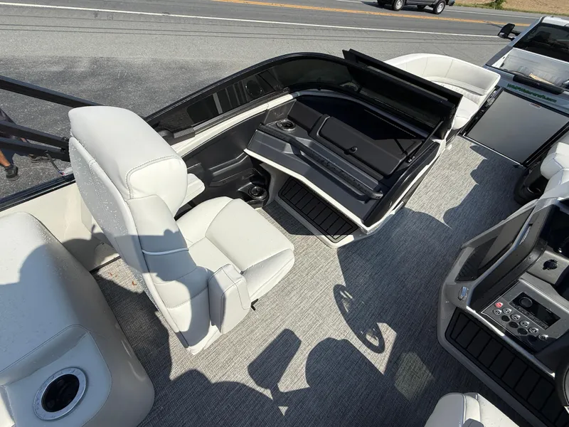 Slide: The Image of 2025 Avalon Catalina Quad Lounger with Shift Windshield, featuring luxurious seating and modern design. - 12