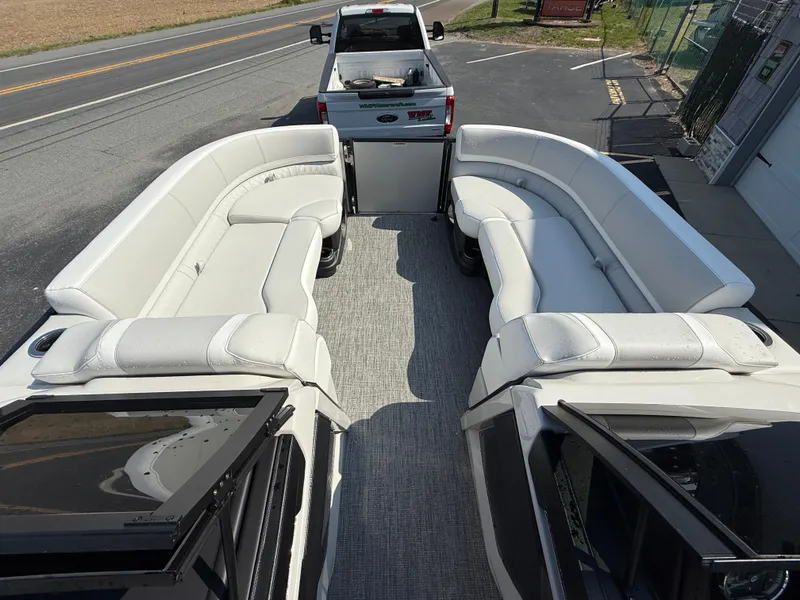 Slide: The Image of 2025 Avalon Catalina Quad Lounger with Shift Windshield, featuring spacious white seating. - 13