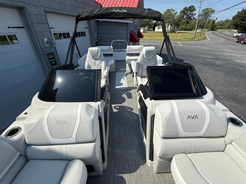 Slide: The Image of 2025 Avalon Catalina Quad Lounger Shift Windshield boat with luxurious seating and modern design. - 16